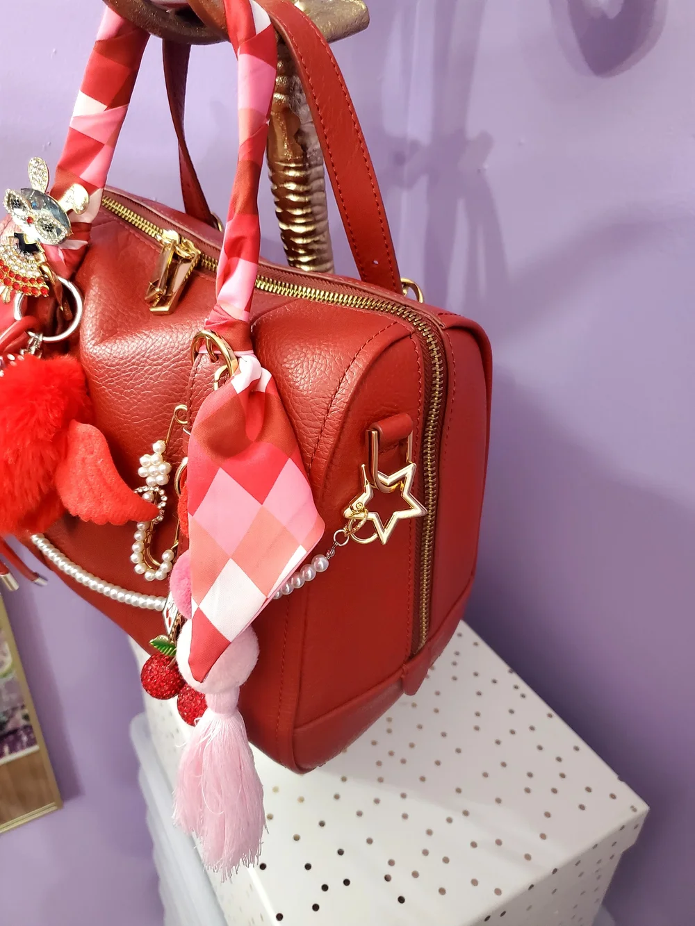 Red Leather Satchel Handbag with Decorative Charms